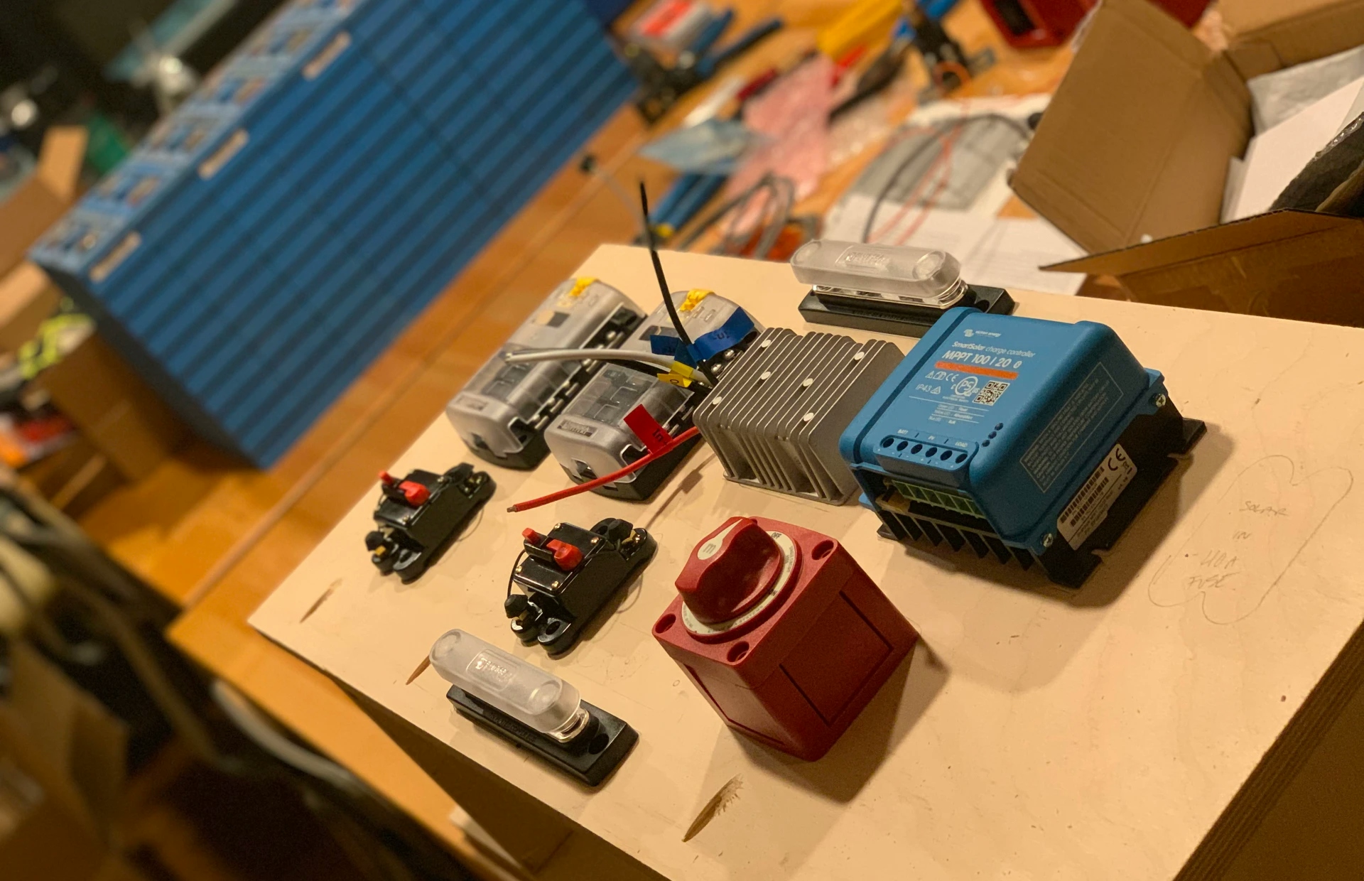 image of heavy duty DC electrical components laid out on kitchen table